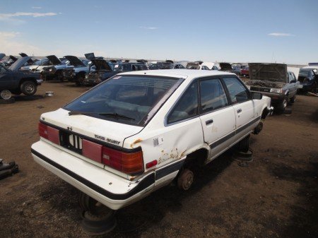 450x337x16-1985-Toyota-Camry-Liftback-Down-On-the-Junkyard-Picture-courtesy-of-Murilee-Martin-450×337.jpg.pagespeed.ic.G8cgT2z8Hy